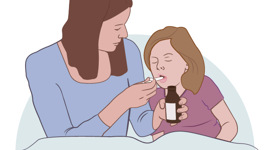 En kvinna ger ett barn medicin med en flaska.