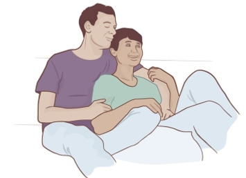Illustration med två personer som sitter nära tillsammans och håller varandras armar.