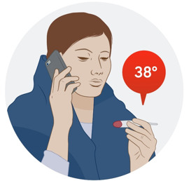 Person pratar i mobiltelefon och håller i en febertermometer.